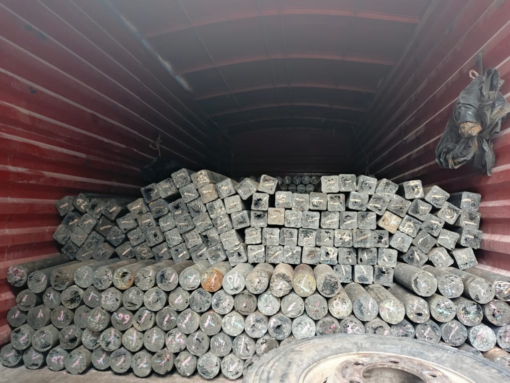 Solid plastic fencing posts in a truck ready for delivery